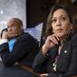 Sen. Kamala Harris, D-Calif., and Sen. Cory Booker, D-N.J., left, pause as protesters disrupt the confirmation hearing of President Donald Trump&#39;s Supreme Court nominee, Brett Kavanaugh, on Capitol Hill in Washington, Tuesday, Sept. 4, 2018. (AP Photo/J. Scott Applewhite) **FILE**