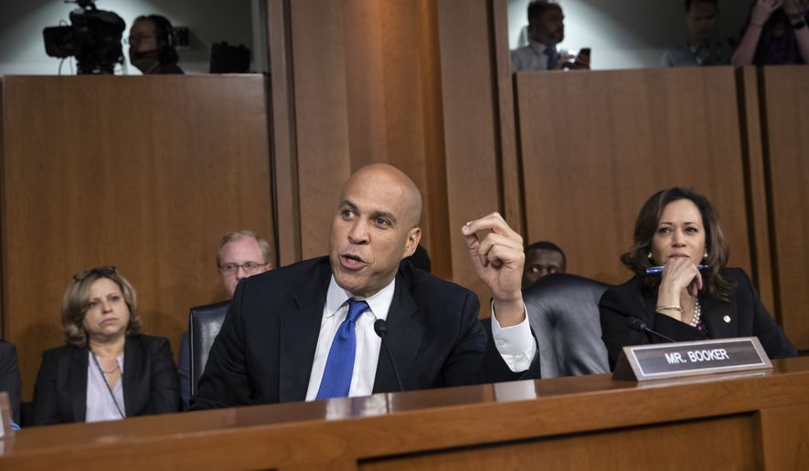 Sen. Cory Booker, D-N.J., and Sen. Kamala Harris, D-Calif., right, and other Democrats on the Senate Judiciary Committee appeal to Chairman Chuck Grassley, R-Iowa, to delay the confirmation hearing of President Donald Trump&#x27;s Supreme Court nominee, Brett Kavanaugh, on Capitol Hill in Washington, Tuesday, Sept. 4, 2018. (AP Photo/J. Scott Applewhite)