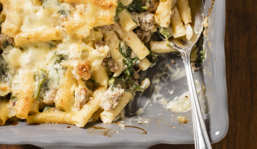 This undated photo provided by America's Test Kitchen in August 2018 shows baked ziti with sausage and broccoli rabe in Brookline, Mass. This recipe appears in “The Complete Make-Ahead Cookbook.” (Daniel J. van Ackere/America's Test Kitchen via AP)