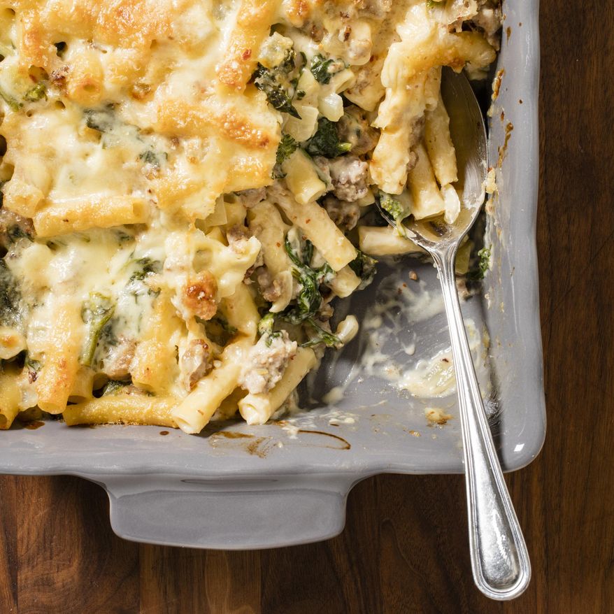 This undated photo provided by America's Test Kitchen in August 2018 shows baked ziti with sausage and broccoli rabe in Brookline, Mass. This recipe appears in “The Complete Make-Ahead Cookbook.” (Daniel J. van Ackere/America's Test Kitchen via AP)