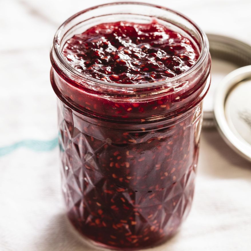 This undated photo provided by America's Test Kitchen in August 2018 shows a raspberry jam in Brookline, Mass. This recipe appears in the cookbook “Foolproof Preserving.” (Daniel J. van Ackere/America's Test Kitchen via AP)