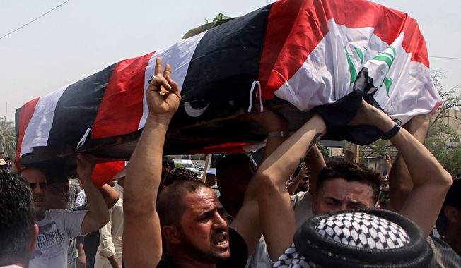 Mourners carry the Iraqi flag-draped coffin of Mekki Yasser, a protester whose family and activists said he was killed when he participated in a protest last night, during his funeral on Tuesday, Sept. 4, 2018, in Basra, about 340 miles (550 kilometers) southeast of Baghdad, Iraq. (AP Photo/Nabil al-Jurani)