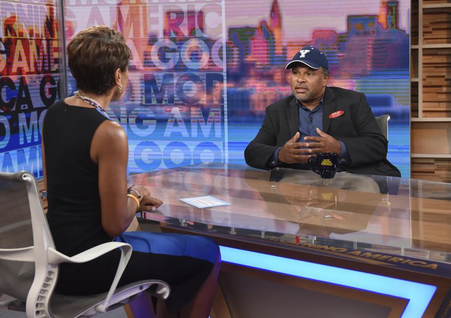 This image released by ABC shows co-host Robin Roberts, left, with "The Cosby Show" actor Geoffrey Owens during an interview on "Good Morning America," Tuesday, Sept. 4, 2018, in New York. Owens says he’s thankful for the support he has received since photos of him working a regular job at a grocery store showed up on news sites. He said on ABC’s “Good Morning America” that he did feel some people were trying to job shame him. But he stressed that “every job is worthwhile and valuable.” (Paula Lobo/ABC via AP)