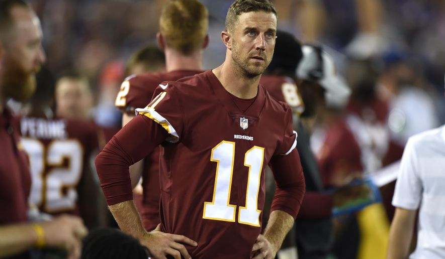 Washington Redskins quarterback Alex Smith stands on the sideline in the first half of a preseason NFL football game against the Baltimore Ravens, Thursday, Aug. 30, 2018, in Baltimore. (AP Photo/Gail Burton)