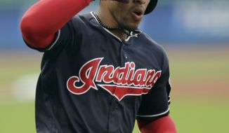 Cleveland Indians&#39; Francisco Lindor salutes as he runs the bases after hitting a solo home run off Kansas City Royals starting pitcher Danny Duffy during the first inning of a baseball game Tuesday, Sept. 4, 2018, in Cleveland. (AP Photo/Tony Dejak)