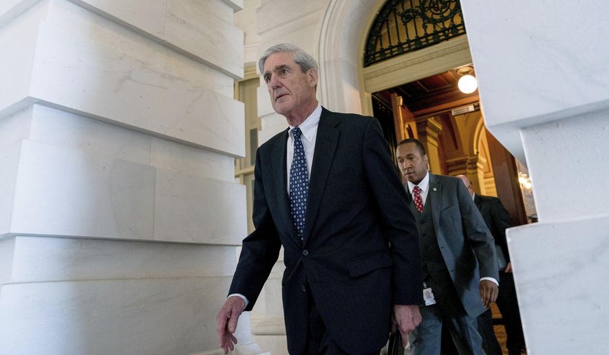 In this June 21, 2017, file photo, former FBI Director Robert Mueller, the special counsel probing Russian interference in the 2016 election, departs Capitol Hill following a closed-door meeting in Washington. (AP Photo/Andrew Harnik)