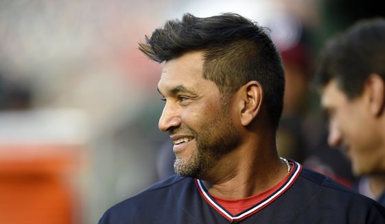 Washington Nationals manager Dave Martinez stands in the dugout before a baseball game against the St. Louis Cardinals, Tuesday, Sept. 4, 2018, in Washington. (AP Photo/Nick Wass) **FILE**