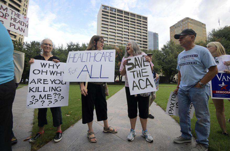 Supporters of the Affordable Care Act protest during a rally at Burnett Park in Fort Worth, Texas, Wednesday, Sept. 5, 2018. Democratic nominee for Texas Attorney General Justin Nelson hosted the Fort Worth Rally for Preexisting Coverage Protection. (Max Faulkner/Star-Telegram via AP)