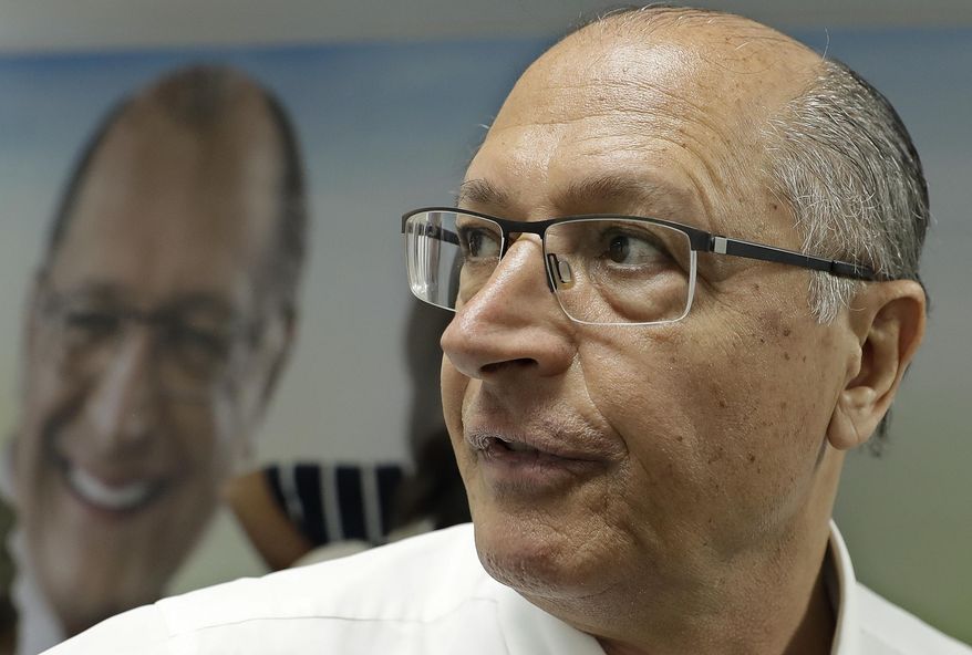 Geraldo Alckmin, former Sao Paulo governor who is running for president with the Social Democratic Party, looks on prior to talking with journalists as he campaigns in Sao Paulo, Brazil, Monday, Sept. 3, 2018. Brazil will hold general elections on Oct. 7. (AP Photo/Andre Penner)