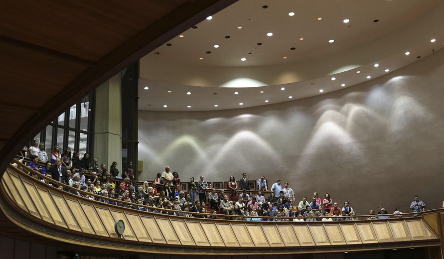 In this Jan. 17, 2018 file photo, members of the public look down into the House chamber at the Hawaii State Legislature in Honolulu. (AP Photo/Audrey McAvoy, File) **FILE**