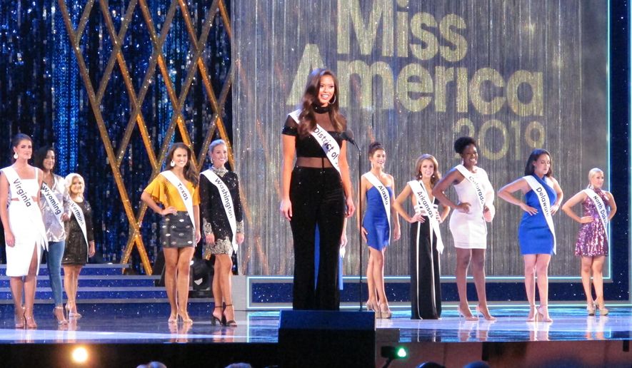 Allison Farris, Miss District of Columbia, introduces herself at the beginning of the first night of preliminary competition in the Miss America competition in Atlantic City, N.J., Wednesday, Sept. 5, 2018. (AP Photo/Wayne Parry)