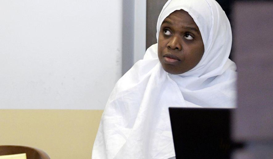 FILE - In this Aug. 13, 2018, file photo, Jany Leveille appears in court during a hearing in Taos, N.M. Five former residents of a ramshackle compound in northern New Mexico where a 3-year-old boy's body was found last month are scheduled to appear in federal court on firearms-related charges. A hearing Tuesday, Sept. 4, 2018 focuses on allegations against Leveille of illegal possession of firearms and ammunition linked to her unlawful immigration status and conspiracy accusations against the four other defendants. (Roberto E. Rosales/The Albuquerque Journal via AP, Pool, File)