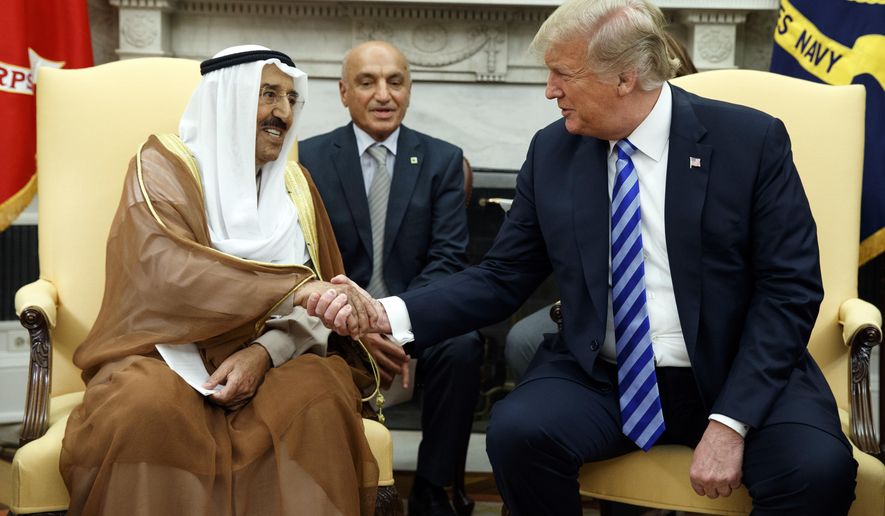 President Donald Trump shakes hands as he meets with Emir of Kuwait Sheikh Sabah Al Ahmad Al Sabah in the Oval Office of the White House, Wednesday, Sept. 5, 2018, in Washington. (AP Photo/Evan Vucci)