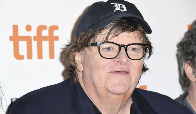 Michael Moore attends the premiere for &quot;Fahrenheit 11/9&quot; on day 1 of the Toronto International Film Festival at the Ryerson Theatre on Thursday, Sept. 6, 2018, in Toronto. (Photo by Arthur Mola/Invision/AP) ** FILE **