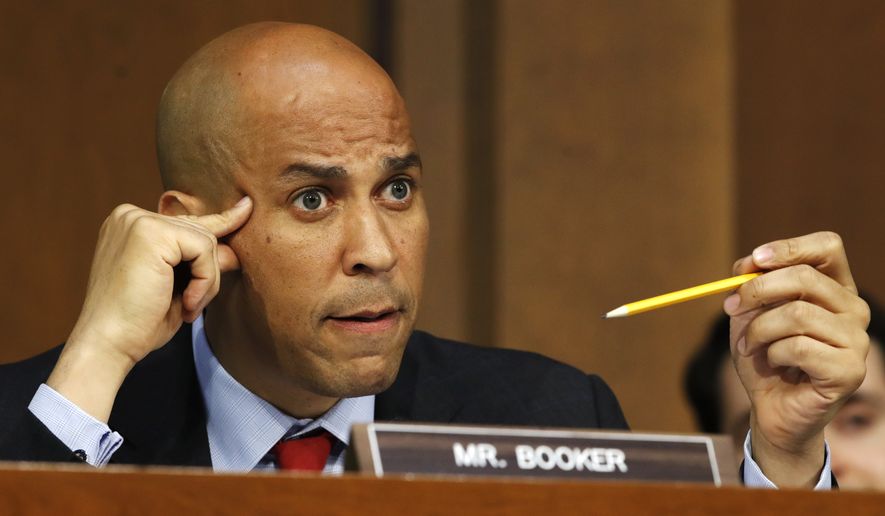 Sen. Cory Booker, D-N.J., asks a question of President Donald Trump&#39;s Supreme Court nominee, Brett Kavanaugh, during a third round on the third day of his Senate Judiciary Committee confirmation hearing, Thursday, Sept. 6, 2018, on Capitol Hill in Washington, to replace retired Justice Anthony Kennedy. (AP Photo/Jacquelyn Martin) ** FILE **