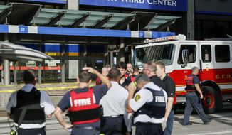 Emergency personnel and police respond to reports of an active shooter situation near Fountain Square, Thursday, Sept. 6, 2018, in downtown Cincinnati. (AP Photo/John Minchillo)