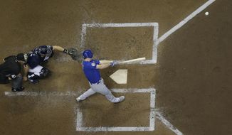 Chicago Cubs&#39; Daniel Murphy hits a home run during the fourth inning of a baseball game against the Milwaukee Brewers Wednesday, Sept. 5, 2018, in Milwaukee. (AP Photo/Morry Gash)