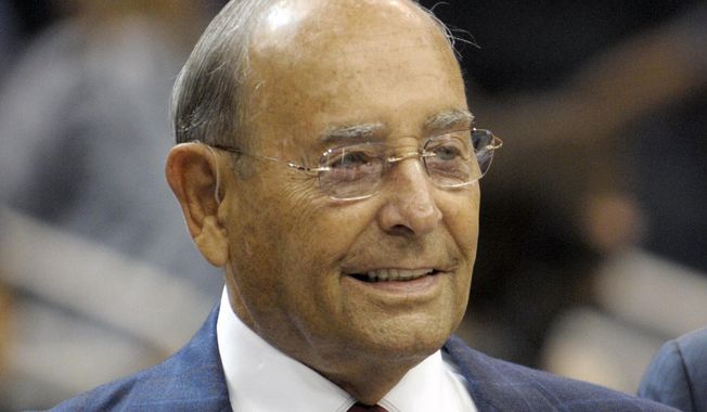 In this Oct. 10, 2010, file photo, Richard DeVos, Orlando Magic owner and Amway Inc. co-founder, smiles after welcoming fans to the new Amway Center before a preseason NBA basketball game against the New Orleans Hornets in Orlando, Fla. DeVos, the billionaire father-in-law of Education Secretary Betsy DeVos, died Thursday, Sept. 6, 2018. He was 92. (AP Photo/Phelan M. Ebenhack, File)