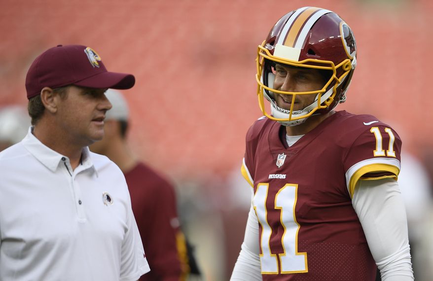 FILE - In this Aug. 16, 2018, file photo, Washington Redskins quarterback Alex Smith (11) stands next to Washington Redskins head coach Jay Gruden before a preseason NFL football game against the New York Jets, in Landover, Md. The Washington Redskins will be trying to give coach Jay Gruden his first victory in a season opener in five tries when they face the Cardinals in Arizona on Sunday. Sept. 9, 2018. The team Gruden will face is something of a mystery, with a rebuilt offense and redesigned defense under new coach Steve Wilks. (AP Photo/Nick Wass, File)