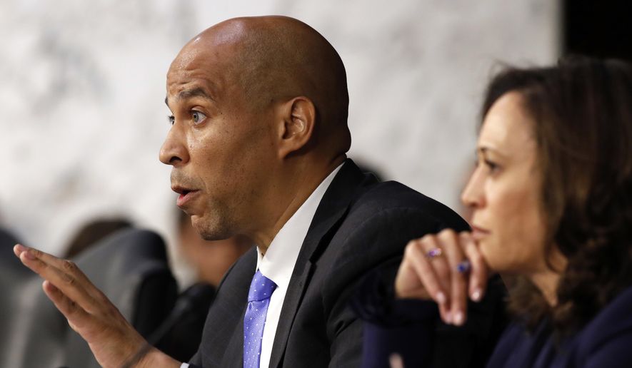 Sen. Cory Booker, D-N.J., left, next to Sen. Kamala Harris, D-Calif., questions President Donald Trump&#39;s Supreme Court nominee, Brett Kavanaugh, as he testifies before the Senate Judiciary Committee on Capitol Hill in Washington, Wednesday, Sept. 5, 2018, on the second day of his confirmation hearing to replace retired Justice Anthony Kennedy. (AP Photo/Jacquelyn Martin)