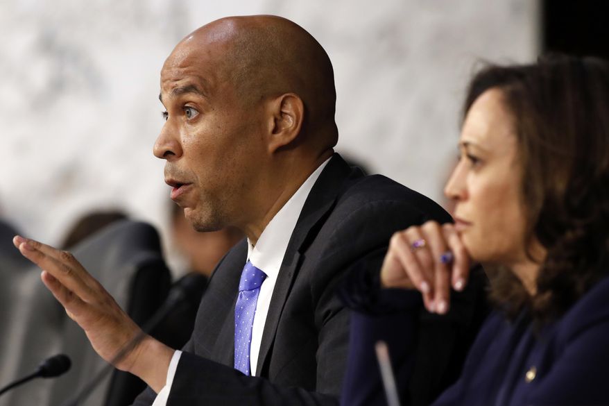 Sen. Cory Booker, D-N.J., left, next to Sen. Kamala Harris, D-Calif., questions President Donald Trump&#39;s Supreme Court nominee, Brett Kavanaugh, as he testifies before the Senate Judiciary Committee on Capitol Hill in Washington, Wednesday, Sept. 5, 2018, on the second day of his confirmation hearing to replace retired Justice Anthony Kennedy. (AP Photo/Jacquelyn Martin)