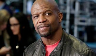 FILE - In this April 10, 2018 file photo, actor Terry Crews appears on the floor of the New York Stock Exchange in New York. Crews and agent Adam Venit have agreed to settle a lawsuit in which Crews alleged Venit groped him at a Hollywood party. Venit’s agency William Morris Endeavor, also named as a defendant, confirmed the deal Thursday in a statement saying the lawsuit would be dismissed. (AP Photo/Richard Drew, File)