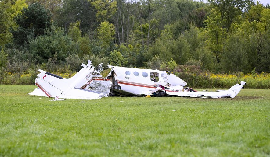 Investigators are on the scene of a fatal plane crash that occurred early Thursday, Sept. 6, 2018, near Wadhams and Yager roads in Kimball Township, Mich. (Brian M. Wells/The Times Herald via AP)