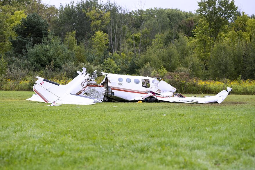 Investigators are on the scene of a fatal plane crash that occurred early Thursday, Sept. 6, 2018, near Wadhams and Yager roads in Kimball Township, Mich. (Brian M. Wells/The Times Herald via AP)