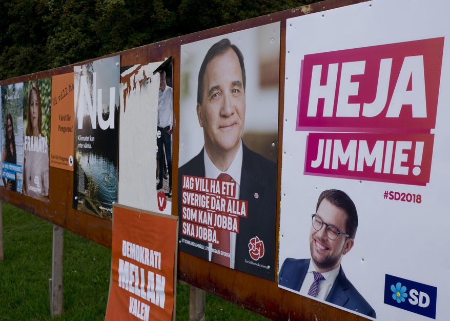 The Aug. 30, 2018 phot shows election poster of Jimmie Akesson,right, leader of the far-right Sweden Democrats and Social Democratic Prime Minister Stefan Lofven, second from right. in Flen, some 100 km west of Stockholm, Sweden. Sweden's 7.3 million voters go to polls on Sept. 9, 2018 to elect a new parliament and government. (AP Photo/Michael Probst)