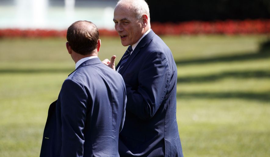 White House Chief of Staff John Kelly, right, follows President Donald Trump to board Marine One on the South Lawn of the White House, Thursday, Sept. 6, 2018, in Washington. (AP Photo/Evan Vucci)