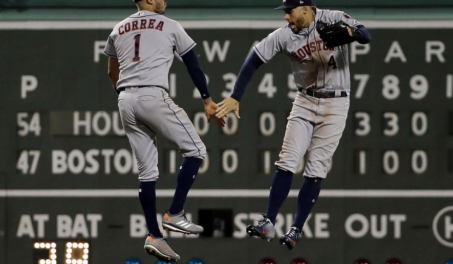 Houston Astros&#39; Carlos Correa (1) and George Springer celebrate after their win over the Boston Red Sox in a baseball game Friday, Sept. 7, 2018, in Boston. (AP Photo/Winslow Townson)