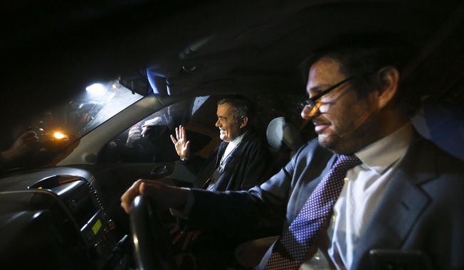 Bishop emeritus Juan Barros waves to the press after leaving the police sex crimes division building in Santiago, Chile. Thursday, Sept. 6, 2018. Prosecutors questioned Barros, who has been accused of covering up the abuses of the country’s most notorious predator priest. (AP Photo/Esteban Felix)