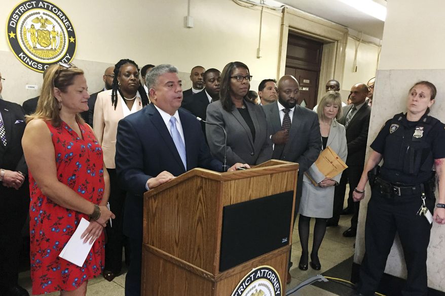 FILE - In this Aug. 9, 2017 file photo, then-acting Brooklyn District Attorney Eric Gonzalez, second from left, holds a news conference in Brooklyn, N.Y. Tens of thousands of low-level marijuana convictions could be erased under a new initiative by District Attorney Eric Gonzalez's plan, which would give people some legal help and the DA's support in getting such misdemeanor convictions tossed out. (AP Photo/Jennifer Peltz, File)