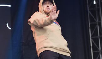 FILE - In this Oct. 2, 2016 file photo, Mac Miller performs at the 2016 The Meadows Music and Arts Festivals at Citi Field in Flushing, N.Y. Miller, the platinum hip-hop star whose rhymes vacillated from party raps to lyrics about depression and drug use, has died at the age of 26. A family statement released through his publicists says Miller died Friday, Sept. 7, 2018, and there are no further details available on how he died. (Photo by Scott Roth/Invision/AP, File)