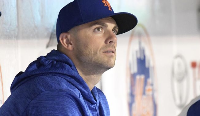 New York Mets&#x27; David Wright watches from the dugout as the Mets and the Philadelphia Phillies play a baseball game Friday, Sept. 7, 2018, in New York. (AP Photo/Bill Kostroun)