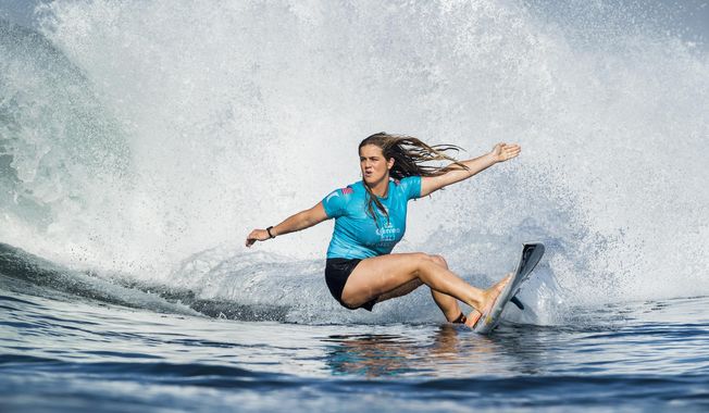 In this photo taken June 1, 2018, and provided by the World Surf League, teen sensation Caroline Marks competes in the Corona Bali Protected at Keramas, Indonesia. Marks showed her brothers, all right, who was the best surfer in the family. Goaded by her siblings at a young age while growing up in Florida, Marks took to the waves with such gusto that at 16, she&#x27;s the youngest competitor on the World Surf League&#x27;s Championship Tour. (Kelly Cestari/World Surf League via AP)