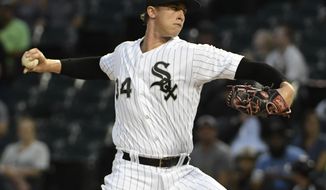 Chicago White Sox starting pitcher Michael Kopech (34) throws against the Detroit Tigers during the first inning of a baseball game, Wednesday, Sept. 5, 2018, in Chicago. (AP Photo/David Banks)