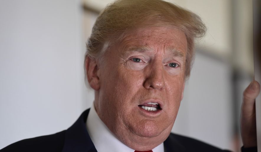 President Donald Trump talks to reporters while in flight from Billings, Mont., to Fargo, N.D., Friday, Sept. 7, 2018. (AP Photo/Susan Walsh)