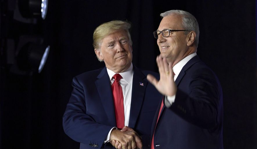 President Donald Trump shakes hands with Senate candidate Kevin Cramer, during a fundraiser in Fargo, N.D., Friday, Sept. 7, 2018. Trump is making his second visit to North Dakota&#39;s biggest city within 10 weeks to campaign for Cramer and build up his finances. (AP Photo/Susan Walsh)