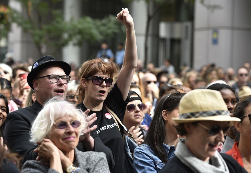 A crowd member reacts to remarks from the stage during the Share Her Journey Rally for Women in Film during the Toronto International Film Festival, on Saturday, Sept. 8, 2018, in Toronto. (Photo by Chris Pizzello/Invision/AP)