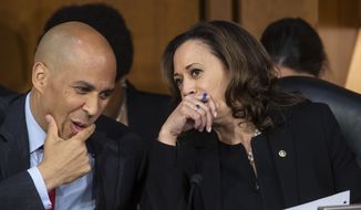 In this Sept. 6, 2018, photo, Sen. Cory Booker, D-N.J., left, and Sen. Kamala Harris, D-Calif., confer before questioning Supreme Court nominee Brett Kavanaugh as he testifies before the Senate Judiciary Committee on the third day of his confirmation hearing, on Capitol Hill in Washington. Spurred on by the left, Democrats brought fire and fury to the confirmation hearings for President Donald Trump&#39;s Supreme Court nominee, but their aggressive tactics have put at least one senator at risk of an ethics investigation. (AP Photo/J. Scott Applewhite)
