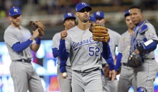 Kansas City Royals watch as pitcher Jorge Lopez, center, leaves after he was pulled in the ninth inning against the Minnesota Twins in a baseball game Saturday, Sept. 8, 2018, in Minneapolis. Lopez had a perfect game through eight innings but gave up a walk and a hit in the ninth. The Royals won 4-1. (AP Photo/Jim Mone)
