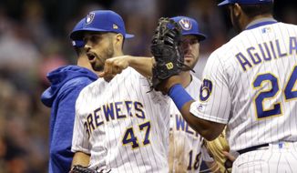 Milwaukee Brewers starting pitcher Gio Gonzalez (47) reacts after being removed from the game against the San Francisco Giants during the sixth inning of a baseball game, Saturday, Sept. 8, 2018, in Milwaukee. (AP Photo/Jeffrey Phelps)