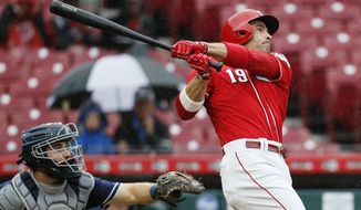 Cincinnati Reds&#39; Joey Votto hits a grand slam off San Diego Padres relief pitcher Robbie Erlin in the second inning of a baseball game, Saturday, Sept. 8, 2018, in Cincinnati. (AP Photo/John Minchillo)