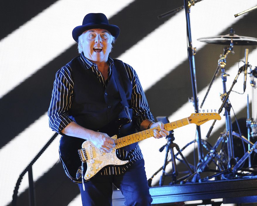 FILE - In this May 24 2013, file photo, Gene Cornish, of The Rascals, performs at Hard Rock Live! in the Seminole Hard Rock Hotel & Casino in Hollywood, Fla. A theater official says Rock & Roll Hall of Fame guitarist Gene Cornish of The Rascals collapsed on stage while performing in Montana. The Billings Gazette reports the 74-year-old Cornish was taken to a hospital after the incident Friday, Sept. 7, 2018. There was no immediate word on his condition. (Photo by Jeff Daly/Invision/AP)