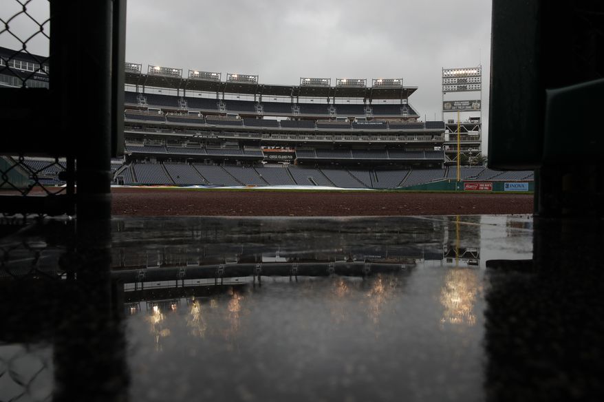 Rain falls on Nationals Park during a rain delay of a baseball game between the Washington Nationals and the Chicago Cubs, Sunday, Sept. 9, 2018, in Washington. (AP Photo/Carolyn Kaster) ** FILE **