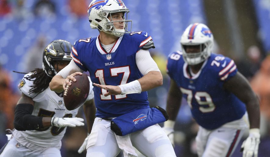 Buffalo Bills quarterback Josh Allen (17) looks for an open man during the second half of an NFL football game between the Baltimore Ravens and the Buffalo Bills, Sunday, Sept. 9, 2018, in Baltimore. The Ravens defeated the Bills 47-3. (AP Photo/Gail Burton)