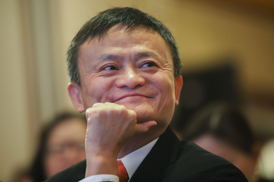 In this June 25, 2018, photo, Jack Ma, chairman of Alibaba Group attends the ceremony to launch a blockchain-base remittance solution in Hong Kong. Jack Ma, who founded e-commerce giant Alibaba Group and helped to launch China&#39;s online retailing boom, announced Monday, Sept. 10, 2018 that he will step down as the company&#39;s chairman next September. In a letter released by Alibaba, Ma said he will be succeeded by CEO Daniel Zhang. Ma handed over the CEO&#39;s post to Zhang in 2013 as part of what he said was a succession process developed over a decade. (Chinatopix via AP)