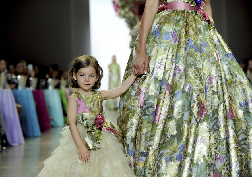 Models walk the runway at Badgley Mischka's 30th anniversary and spring 2019 runway show during New York Fashion Week, Saturday, Sept. 8, 2018. (AP Photo/Diane Bondareff)