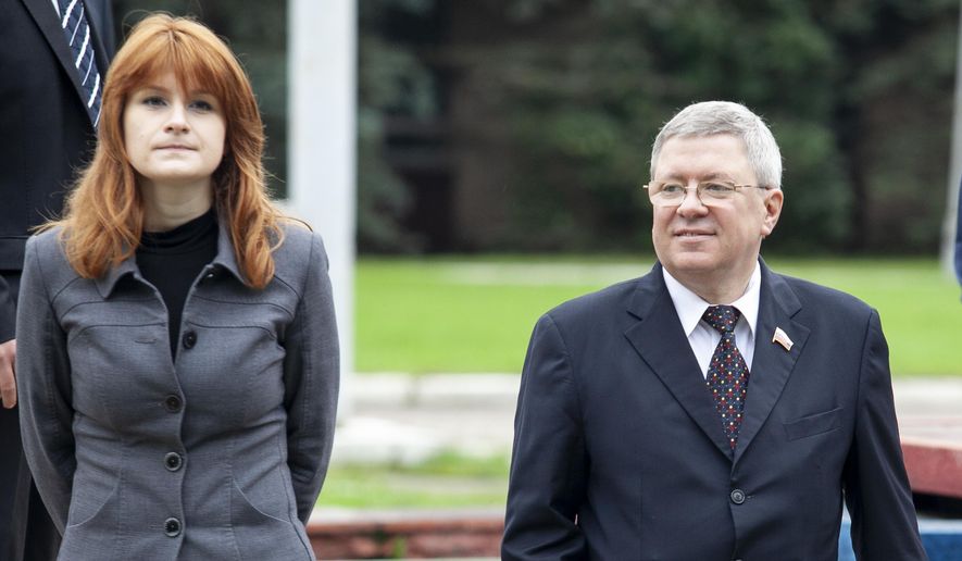 In this photo taken on Friday, Sept. 7, 2012, Maria Butina walks with Alexander Torshin then a member of the Russian upper house of parliament in Moscow, Russia. (AP Photo/Pavel Ptitsin)